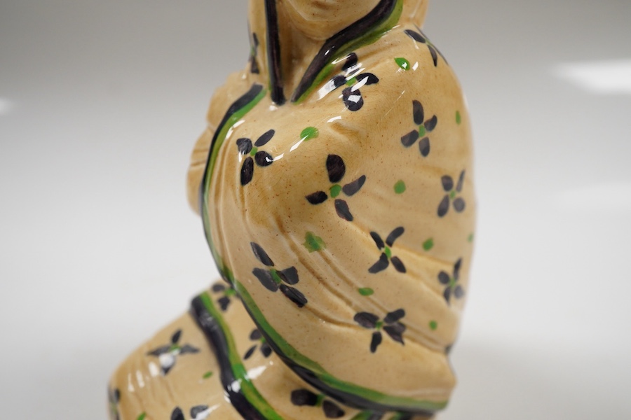 An Ashtead pottery figure of a kneeling ‘eastern lady’, stamped to the base, 15cm high